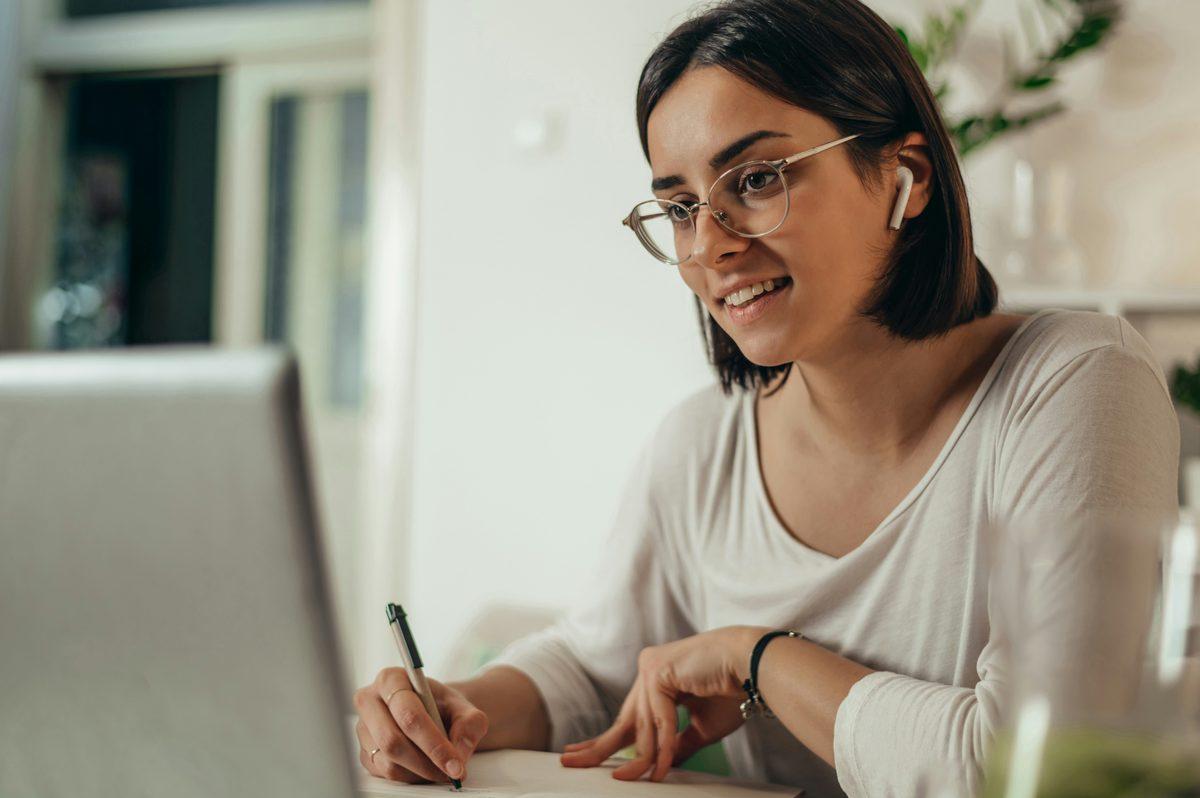 A founder building her AI app on a laptop